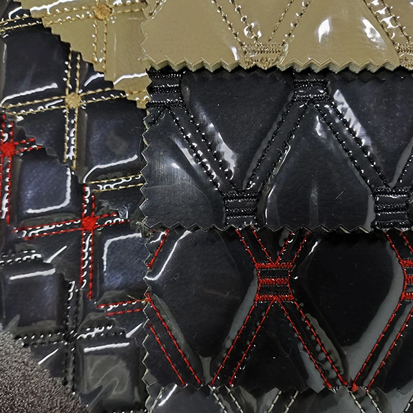 Cuero bordado con lámina transparente de PVC